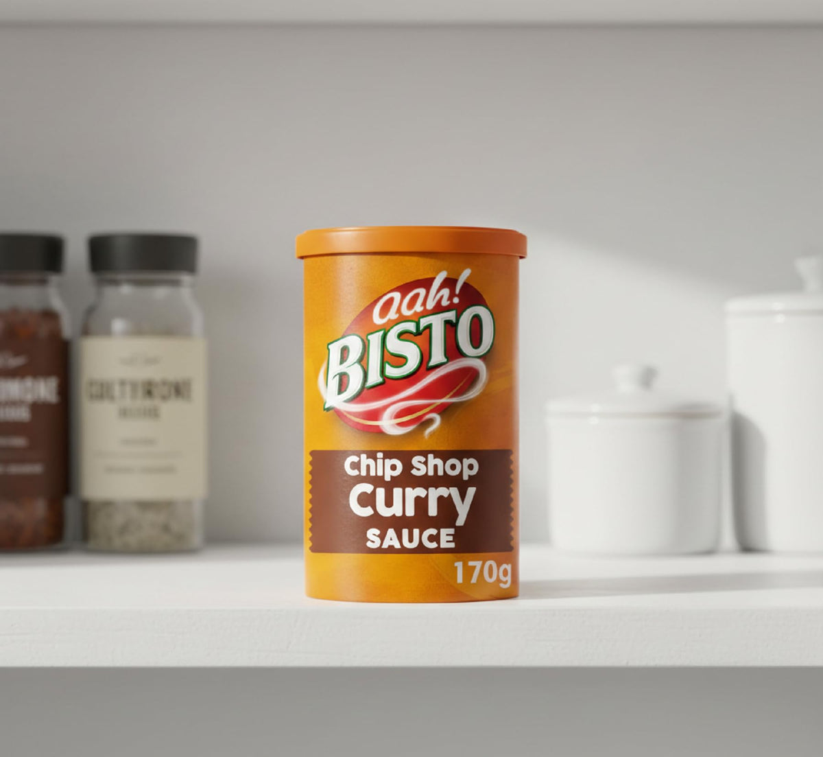 Bisto Chip Shop Curry Sauce Granules close-up, rich texture ready to enhance any dish.