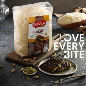 Kataifi dough in a baking pan ready for nest-shaped pastries and baklava variants.