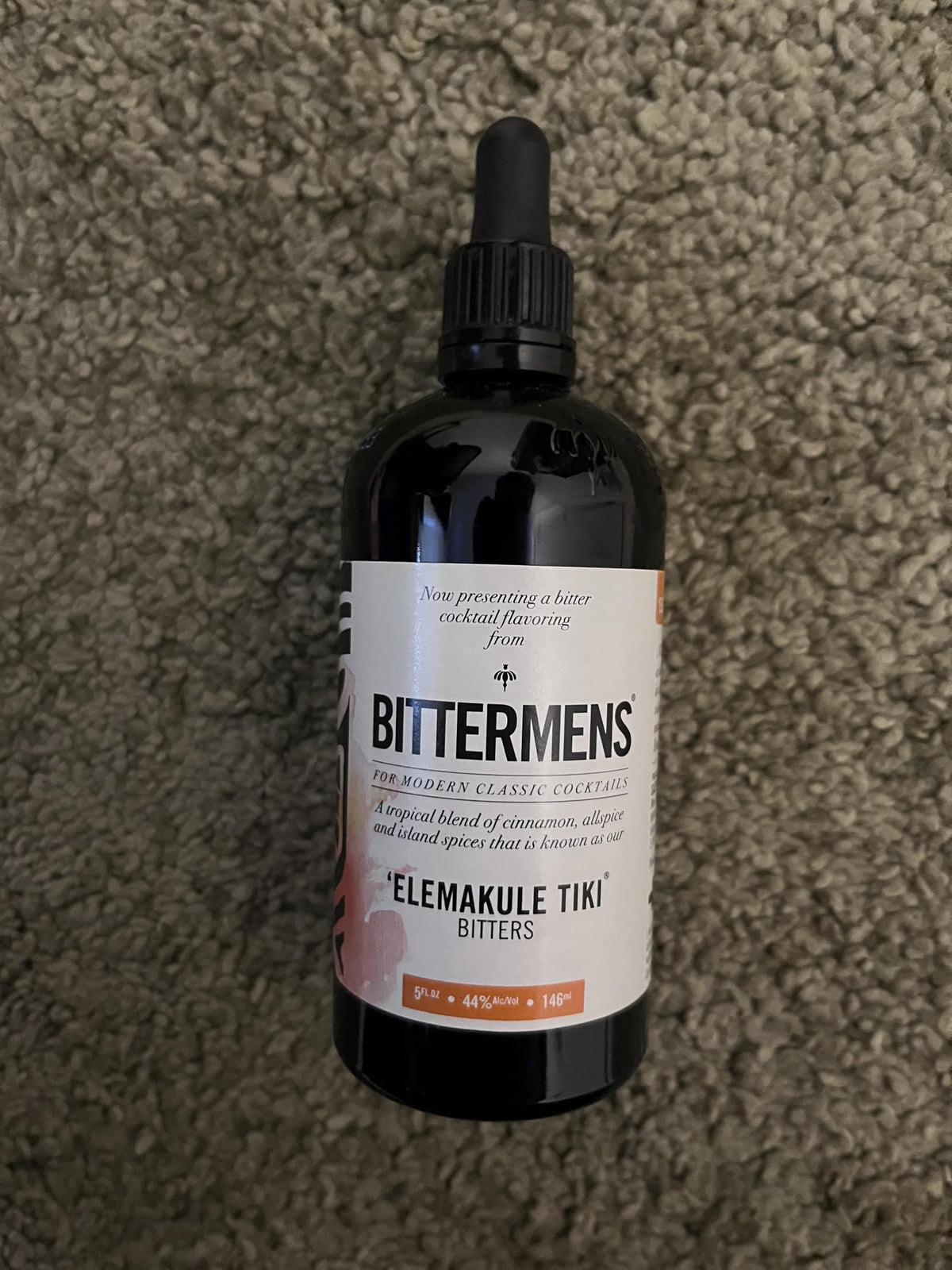 Bittermens Elemakule Tiki Bitters in a tiki cocktail, adding spice depth.