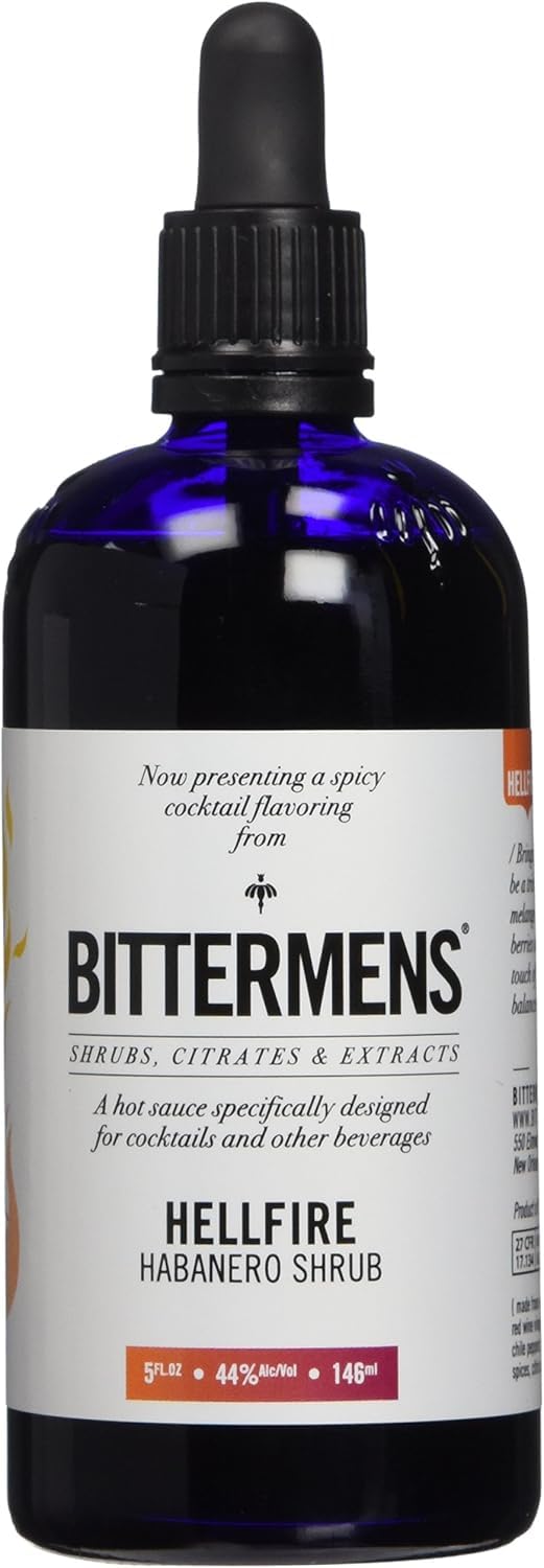 Bittermens Hellfire bottle on bar showcases bold heat and balance for cocktails