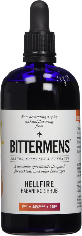 Bittermens Hellfire bottle on bar showcases bold heat and balance for cocktails
