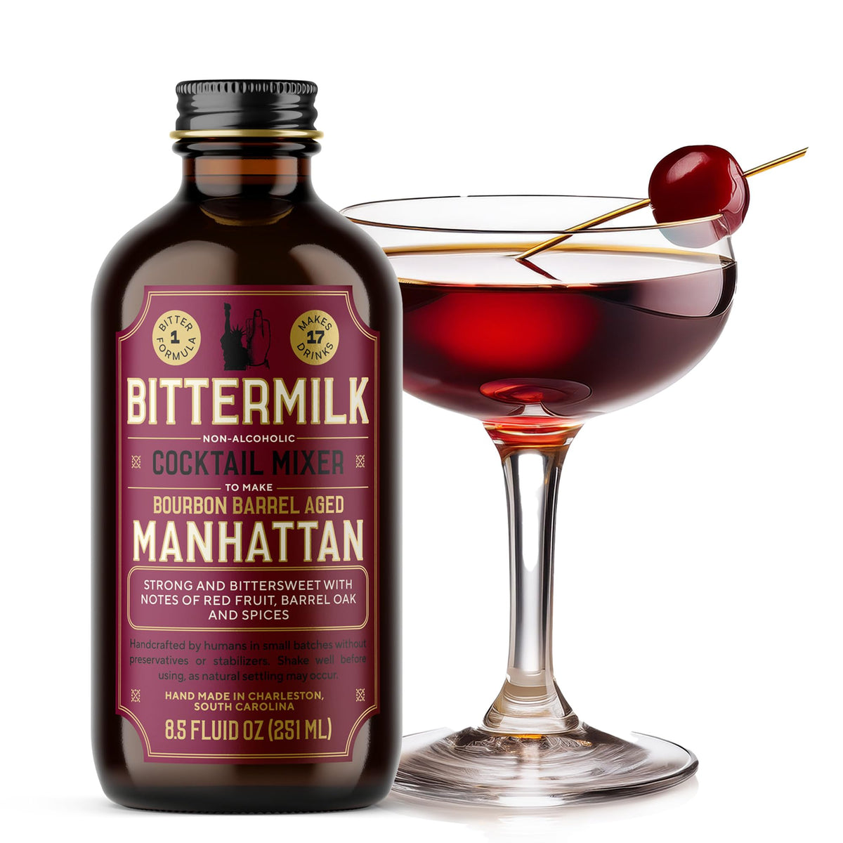 Bittermilk bourbon barrel aged Manhattan mix bottle against a dark bar backdrop