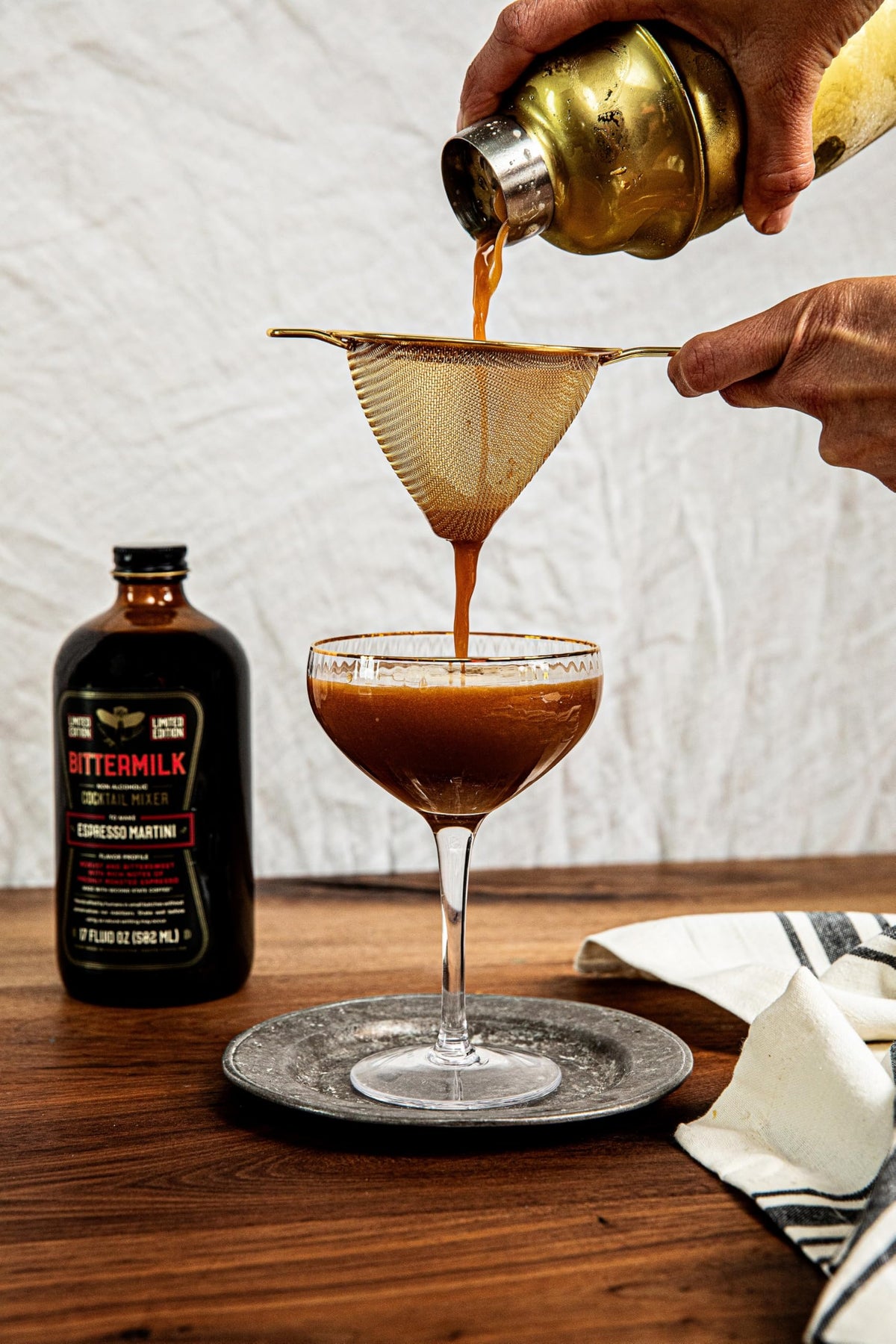 Bartender-inspired setup with shaker and Bittermilk mixer for easy premium cocktails.