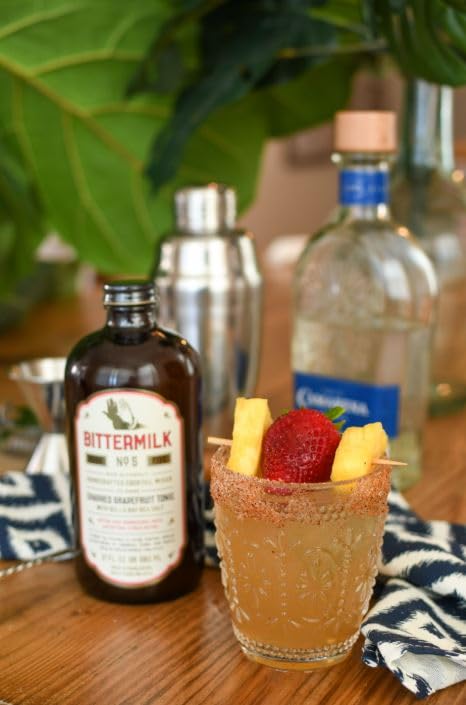 Bittermilk No.5 pour shows the golden hue of a premium mixer.