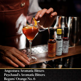 Bitters Triple Play Old Fashioned setup showcasing traditional mixology