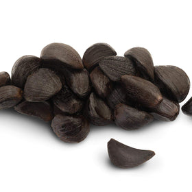 Black Garlic North America peeled cloves stored in pantry-ready container.