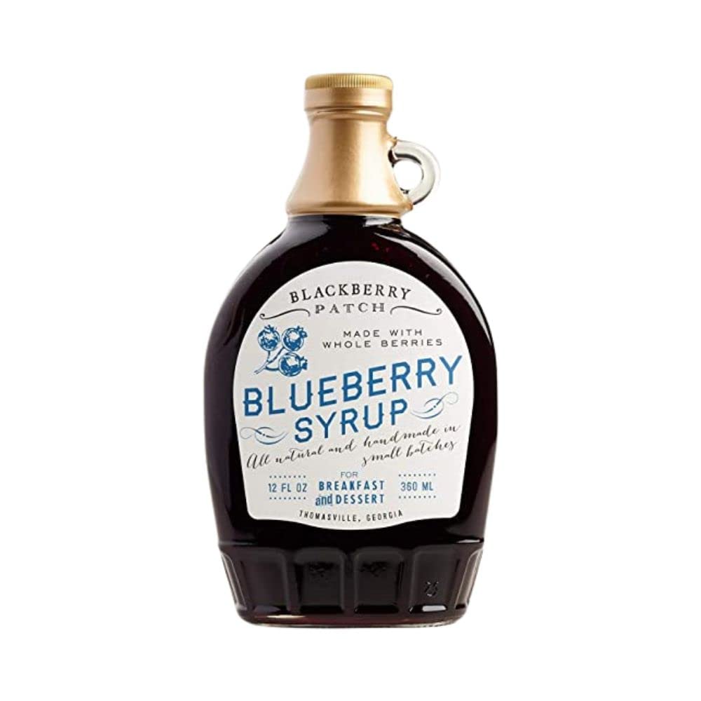 Blackberry Patch Blueberry Syrup being poured over pancakes, a versatile breakfast treat.