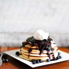 Blackberry Patch N's Wild Blueberry Syrup drizzled on vanilla ice cream
