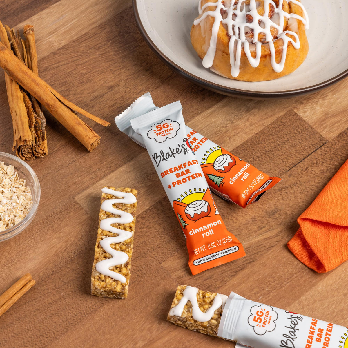 Vegan and nut-free badge on Blake's Cinnamon Roll bar packaging.
