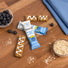 Blake's Seed Based Breakfast Bars portable snack bag in hand