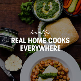 Family table with Blank Slate Kitchen Zhug as a vegan option
