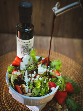 Blazing Bella balsamic pour mid-drizzle, ideal for elevating salads and roasted vegetables