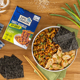 Steam rises from a ready-to-eat Blue Dragon bowl.