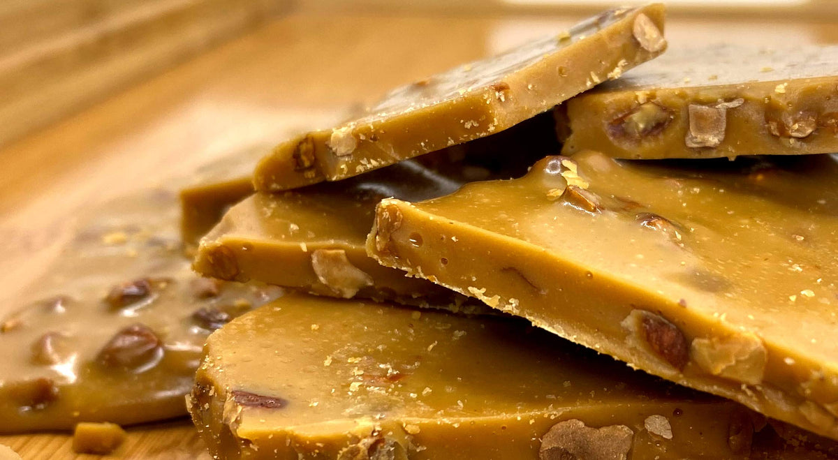 Blue House Candies almond toffee slice reveals caramel and almonds, delicious tasting