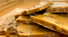 Blue House Candies almond toffee slice reveals caramel and almonds, delicious tasting