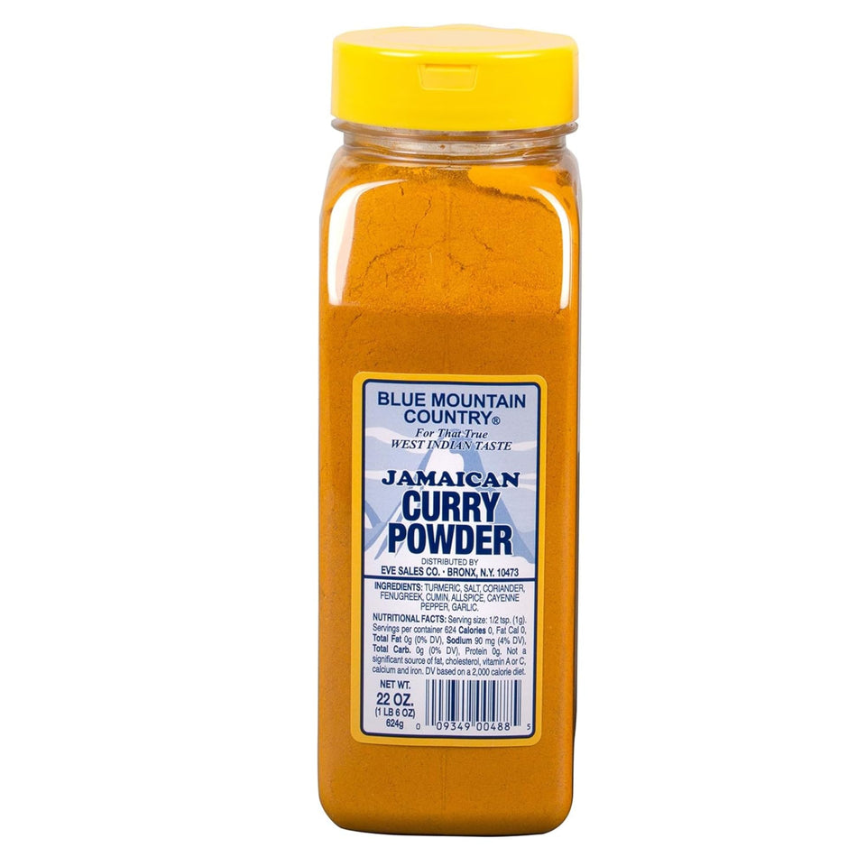 Blue Mountain Country Jamaican Curry Powder bottle pour for authentic West Indian flavor