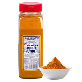 Blue Mountain Country Jamaican Curry Powder being poured shows fiery heat for recipes