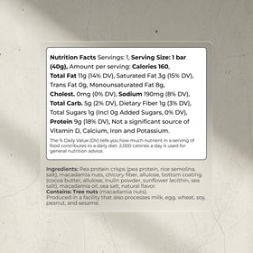Close-up texture of Blueprint Bryan Johnson macadamia bar with white cocoa and macadamias