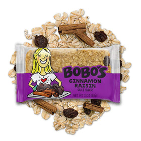 Bobos Cinnamon Raisin Oat Bars served on a wooden plate, cozy snack for kids and adults