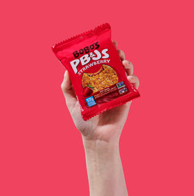 Desk-ready setup with Bobo's PB&J bars for quick breaks.