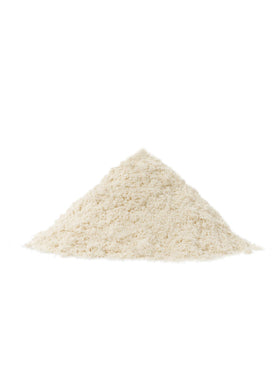 Salad dressing prepared with Bob's Red Mill almond protein powder for silky texture.