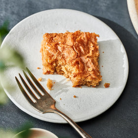 Warm blondies served with ice cream for a comforting treat.
