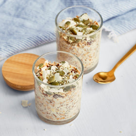 Bob’s Red Mill Gluten Free Muesli overnight oats jar ready to mix with yogurt.