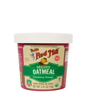 Bob's Red Mill Organic Oat Cup Cranberry Orange cup closeup shows real fruit and wholesome grains.