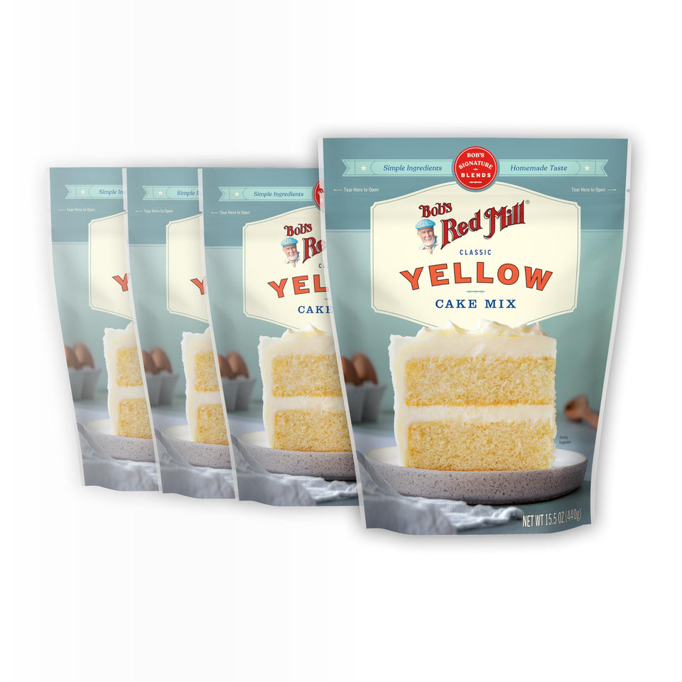 Bob's Red Mill Signature Yellow Cake Mix pack of four on counter for quick, delicious results.