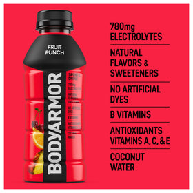 Person holds BodyArmor Fruit Punch bottle for on-the-go hydration after workouts.