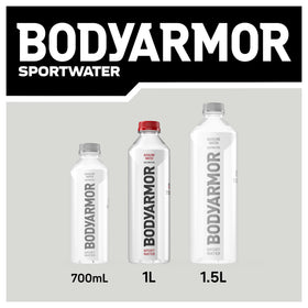 Outdoor workout with BODYARMOR SportWater bottle during a trail run