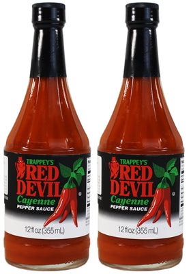 Boiyiklonn Trappey's Red Devil hot sauce being poured for a bold flavor boost.