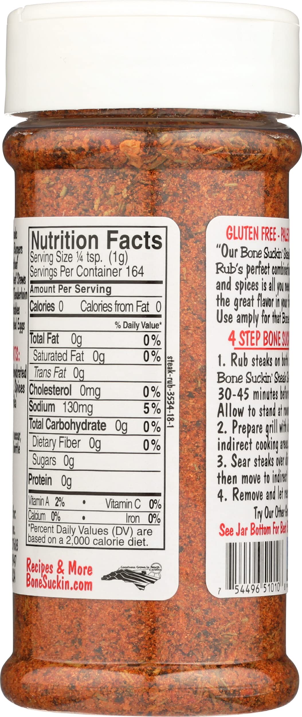 Bone Suckin' Steak Seasoning bottle in use for even coating on meat.