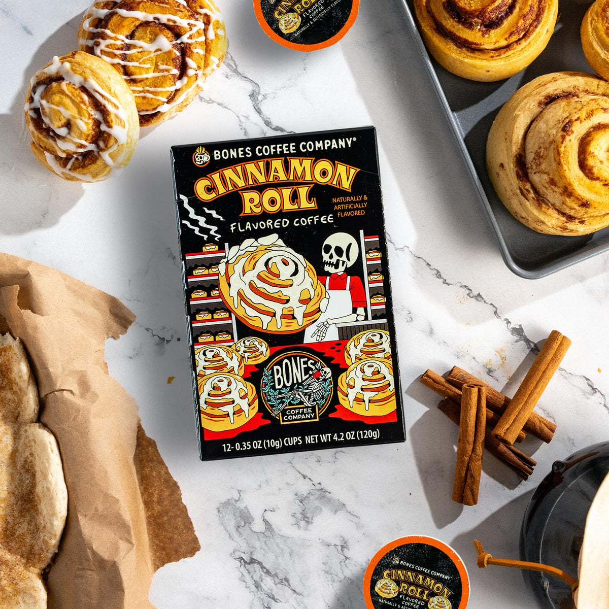 Bones Coffee Company Cinnamon Roll Pod close-up, showing Keurig 1.0 and 2.0 compatibility.