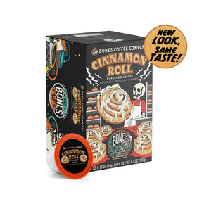 Bones Coffee Company Cinnamon Roll Pod packaging beside recyclable symbol, highlighting eco-friendly choice.