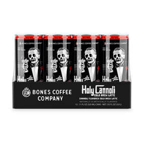 Bones Coffee Holy Cannoli Latte can being poured over ice for on-the-go refreshment.