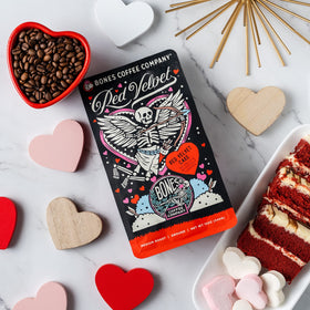 Bones Coffee Red Velvet labeled pack on wood surface