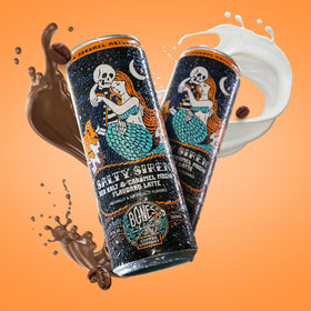 Bones Coffee Salty Siren Latte can being poured into a glass for creamy latte.