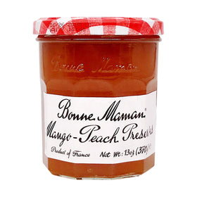 Bonne Maman Mango Peach preserves in a jar, rich color, ideal for toast