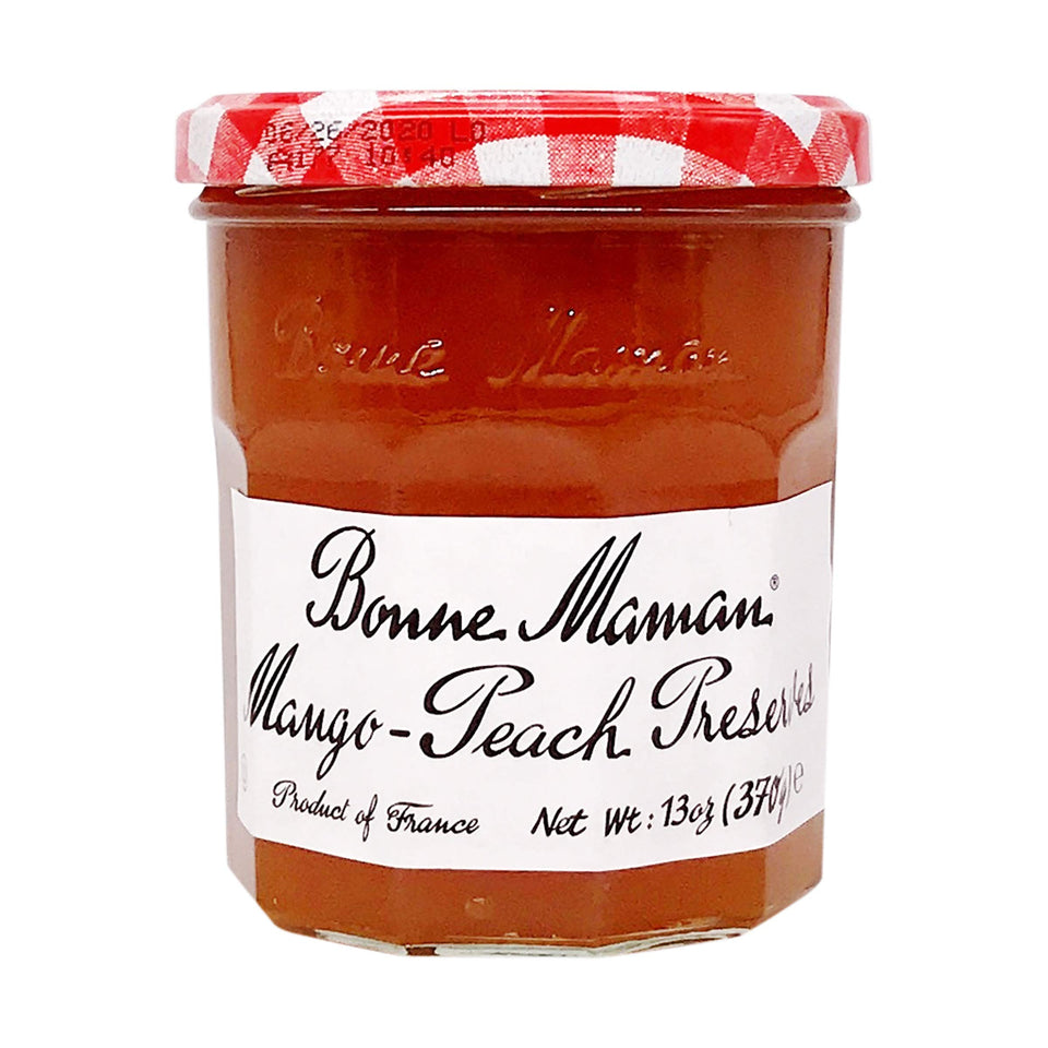 Bonne Maman Mango Peach preserves in a jar, rich color, ideal for toast
