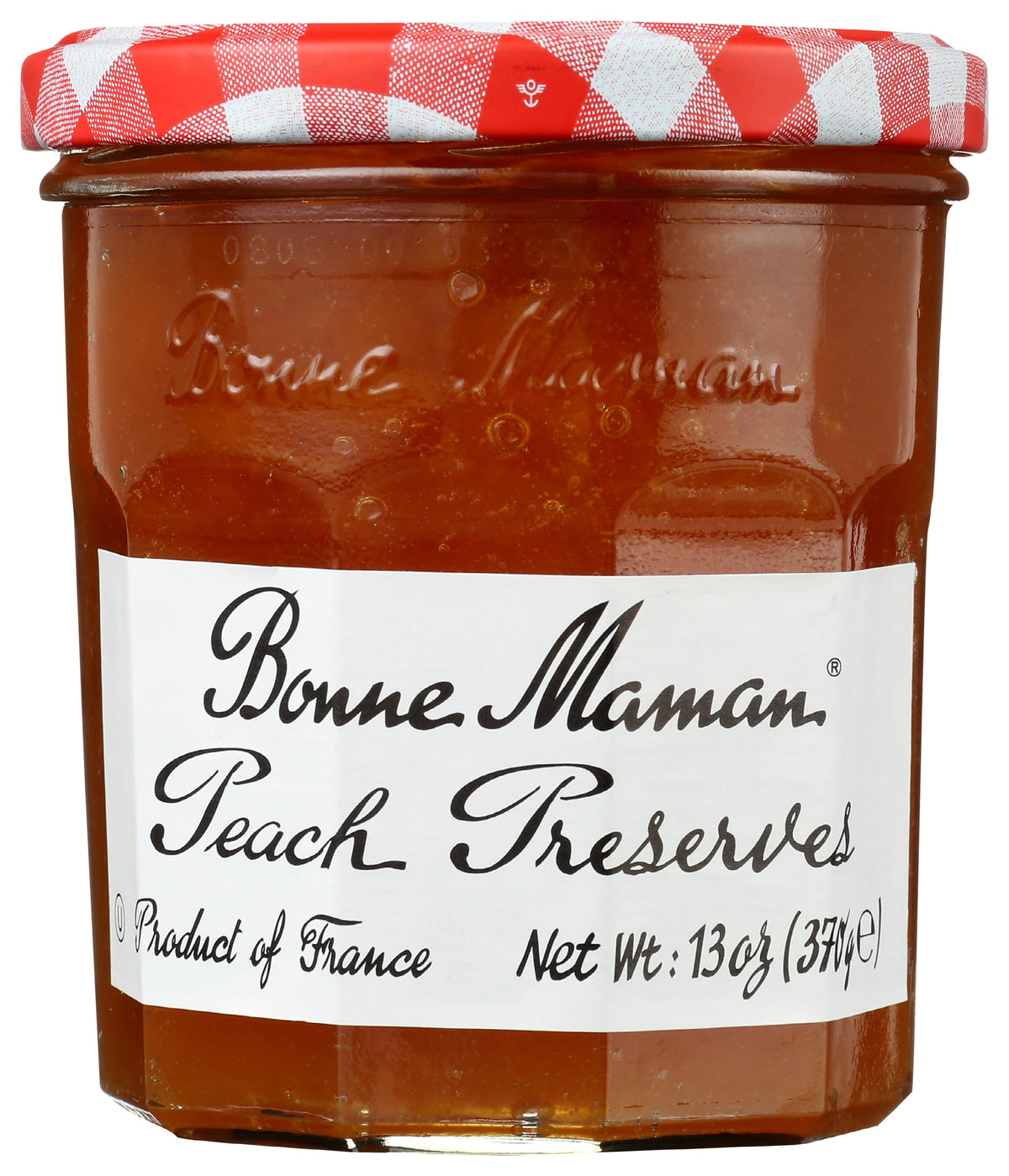 Bonne Maman Peach Preserve jar on shelf, premium fruit flavor perfect for toast.
