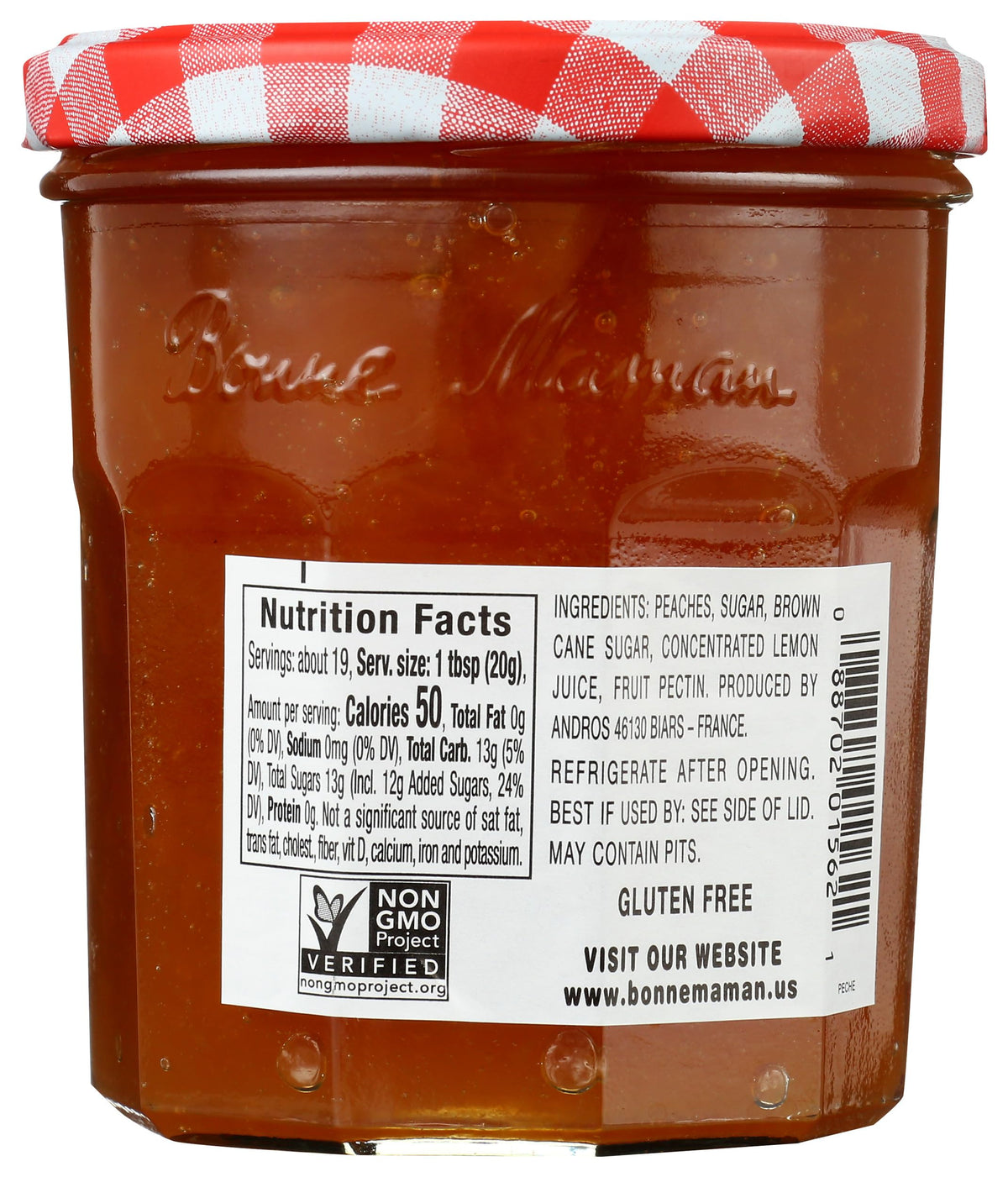Bonne Maman Peach Preserve lid open, ready to spread on warm toast.