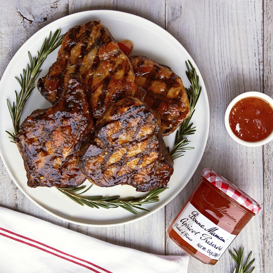 Bonne Maman Strawberry Preserves jar highlighting whole fruit in a vibrant glaze for toast.