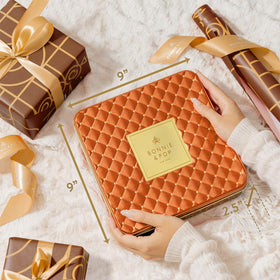 Peanut clusters and coconut haystacks add luxurious finishes in Bonnie & Pop gift box.