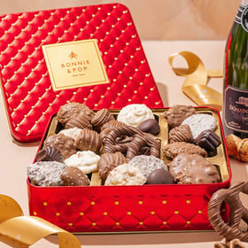 BONNIE AND POP red tin close-up showcasing premium chocolates for festive gifting