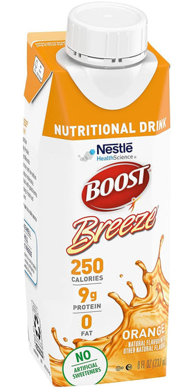 Pouring BOOST Breeze into a glass for a refreshing snack.