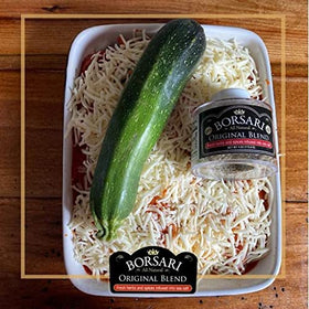 Borsari Original Seasoning Salt on salad vegetables for fresh greens flavor.