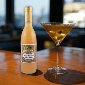 Boscoli martini glass with olive, showcasing cocktail-ready presentation.