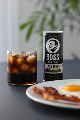 BOSS Coffee can label shows 0 sugar and 140mg caffeine.