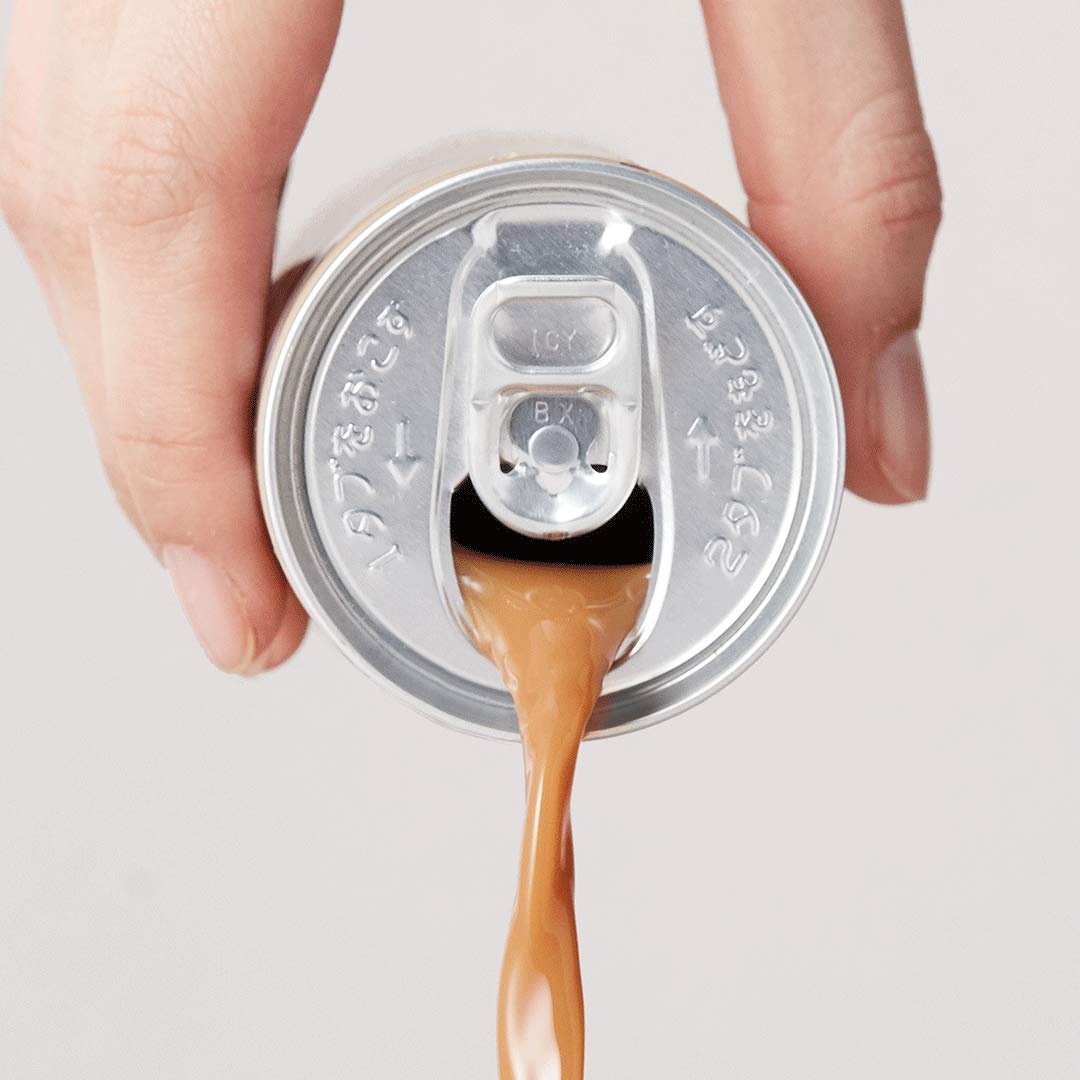 BOSS Coffee being poured into a glass to reveal aroma and smooth finish.